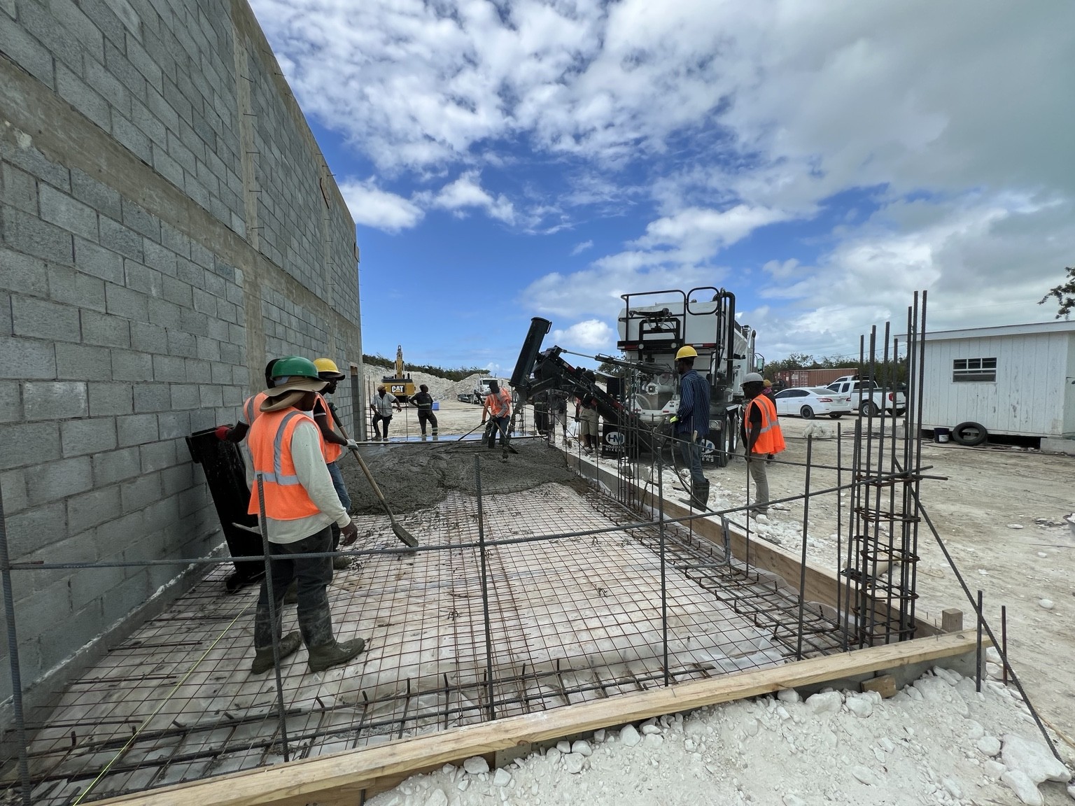 Crew and equipment working on a slab placement