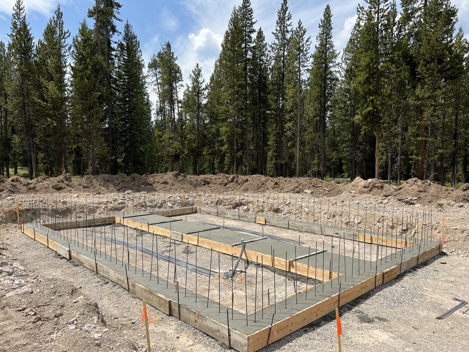 Prepared foundation slab and reinforcing steel at a remote project site